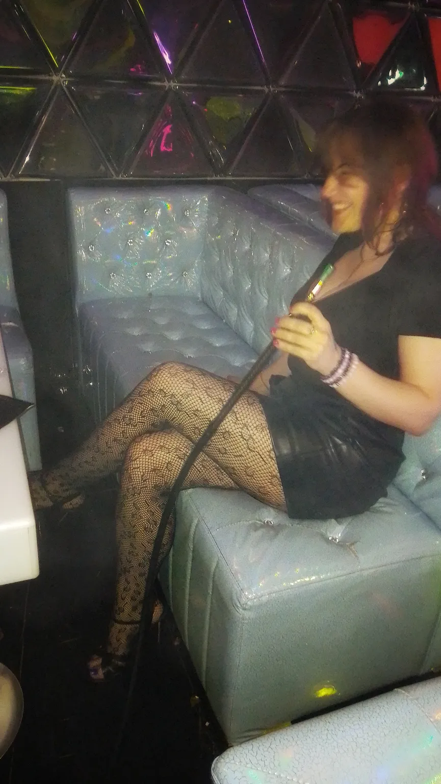 Maryna trying hookah for the first time at LVL Three Lounge in Calgary